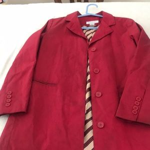 A lady’s coat water proved size S dark red.